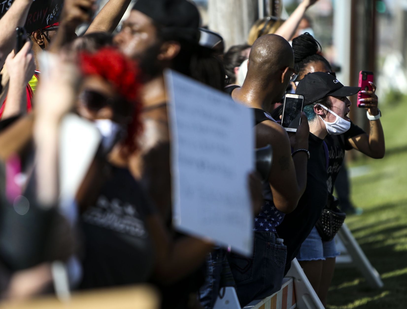 Protesters march down Highway 67
